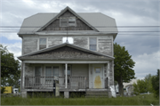 6945 STATE RD 76, a American Foursquare house, built in Vinland, Wisconsin in 1910.