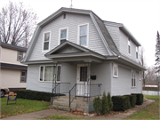 192 N MAIN ST, a Dutch Colonial Revival house, built in Clintonville, Wisconsin in 1917.