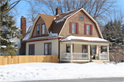 803 DERBY LN, a Dutch Colonial Revival house, built in Allouez, Wisconsin in 1910.