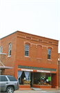 238 N Main St, a Commercial Vernacular retail building, built in Loyal, Wisconsin in 1900.