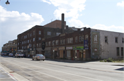 817-831 N 27TH ST, a Spanish/Mediterranean Styles retail building, built in Milwaukee, Wisconsin in 1926.