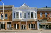 205 W MAPLE ST, a Queen Anne large retail building, built in Lancaster, Wisconsin in 1904.