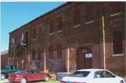 230 MONROE ST N, a Astylistic Utilitarian Building roundhouse/repair shop/car barn, built in North Hudson, Wisconsin in 1890.