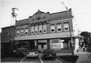104 JANESVILLE ST, a Romanesque Revival large retail building, built in Oregon, Wisconsin in 1898.
