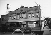 104 JANESVILLE ST, a Romanesque Revival retail building, built in Oregon, Wisconsin in 1898.