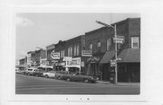 102-106 WALNUT ST, a Commercial Vernacular tavern/bar, built in Spooner, Wisconsin in 1904.