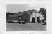 HIGHWAY 53, a Astylistic Utilitarian Building garage, built in Spooner, Wisconsin in 1939.