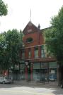 137-139-141 E 2ND ST, a Romanesque Revival retail building, built in Kaukauna, Wisconsin in 1895.