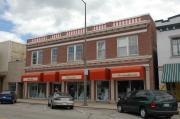 172-176 W WISCONSIN AVE, a Neoclassical/Beaux Arts retail building, built in Kaukauna, Wisconsin in 1928.