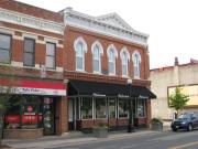 113 S 2ND ST, a Italianate retail building, built in La Crosse, Wisconsin in 1879.