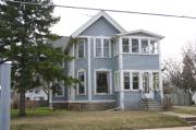 319 E IRVING AVE, a Queen Anne house, built in Oshkosh, Wisconsin in 1890.