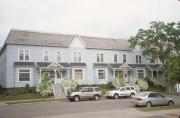 302-310 W GRAND AVE, a Queen Anne row house/townhouse, built in Eau Claire, Wisconsin in 1891.