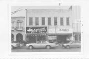 209-211 N WASHINGTON ST, a Commercial Vernacular large retail building, built in Green Bay, Wisconsin in 1869.