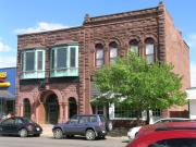 14 E BAYFIELD ST  (USH 13), a Romanesque Revival bank/financial institution, built in Washburn, Wisconsin in 1889.