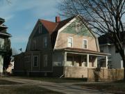 607 - 609 N MAPLE AVE, a Dutch Colonial Revival duplex/two-flat, built in Green Bay, Wisconsin in 1909.