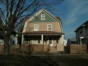 607 - 609 N MAPLE AVE, a Dutch Colonial Revival duplex/two-flat, built in Green Bay, Wisconsin in 1909.