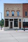 301 W MAIN AVE, a Commercial Vernacular small retail building, built in De Pere, Wisconsin in 1887.