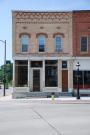 301 W MAIN AVE, a Commercial Vernacular retail building, built in De Pere, Wisconsin in 1887.