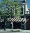 180-184 E MAIN ST, a Romanesque Revival retail building, built in Stoughton, Wisconsin in 1876.