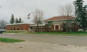 10 N 3RD ST, a Prairie School library, built in Barron, Wisconsin in 1912.