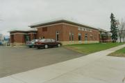 10 N 3RD ST, a Prairie School library, built in Barron, Wisconsin in 1912.