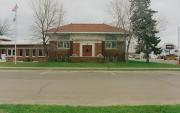 10 N 3RD ST, a Prairie School library, built in Barron, Wisconsin in 1912.