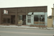 116-20 W 2ND ST (aka MAIN ST W), a Romanesque Revival small retail building, built in Ashland, Wisconsin in 1891.