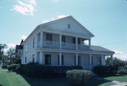 421 CASS ST, a Greek Revival house, built in De Pere, Wisconsin in 1854.