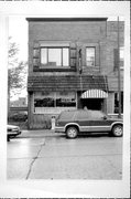 313 MAIN AVE, a Commercial Vernacular small retail building, built in De Pere, Wisconsin in 1912.