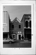 215 N WASHINGTON ST, a Commercial Vernacular small retail building, built in Green Bay, Wisconsin in 1977.
