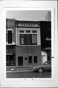 219 N WASHINGTON ST, a Commercial Vernacular small retail building, built in Green Bay, Wisconsin in 1890.