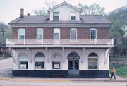 215 N MAIN ST, a Side Gabled general store, built in Alma, Wisconsin in 1861.