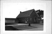 S913 STH 88, 0.13 MI N OF COUNTY HIGHWAY NN, a Romanesque Revival one to six room school, built in Gilmanton, Wisconsin in 1913.