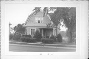 1411 WISCONSIN AVE, a Dutch Colonial Revival house, built in New Holstein, Wisconsin in 1914.