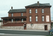 236 W RIVER ST, a Italianate blacksmith shop, built in Chippewa Falls, Wisconsin in 1868.