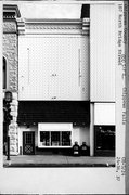 107 N BRIDGE ST, a Commercial Vernacular small retail building, built in Chippewa Falls, Wisconsin in 1886.