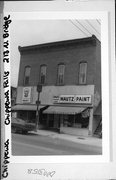213-215 N BRIDGE ST, a Commercial Vernacular small retail building, built in Chippewa Falls, Wisconsin in 1889.