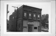 514 N BRIDGE ST, a Commercial Vernacular small retail building, built in Chippewa Falls, Wisconsin in 1907.