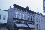 114-118 N LUDINGTON, a Early Gothic Revival large retail building, built in Columbus, Wisconsin in 1877.