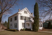 348 S DICKASON BLVD, a Greek Revival house, built in Columbus, Wisconsin in 1857.