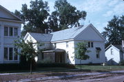 214 W HOWARD ST, a Greek Revival house of worship, built in Portage, Wisconsin in 1855.