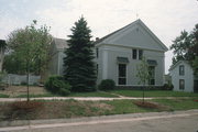 214 W HOWARD ST, a Greek Revival house of worship, built in Portage, Wisconsin in 1855.