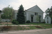 214 W HOWARD ST, a Greek Revival church, built in Portage, Wisconsin in 1855.