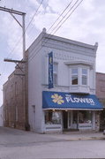 211 DEWITT, a Commercial Vernacular small retail building, built in Portage, Wisconsin in 1899.