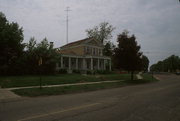 532 W WISCONSIN ST, a Greek Revival house, built in Portage, Wisconsin in 1855.