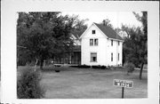 W1934 STATE HIGHWAY 60, a Gabled Ell house, built in Columbus, Wisconsin in 1910.
