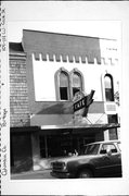 109-115 W COOK ST, a Italianate small retail building, built in Portage, Wisconsin in 1887.