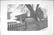 223 W PLEASANT, a Side Gabled carriage house, built in Portage, Wisconsin in 1877.