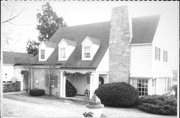 1230 W PLEASANT ST, a Colonial Revival/Georgian Revival house, built in Portage, Wisconsin in 1936.