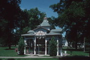 SWAN PARK AT NW CNR OF S UNIVERSITY ST AND E SOUTH ST, a Queen Anne pavilion, built in Beaver Dam, Wisconsin in 1880.
